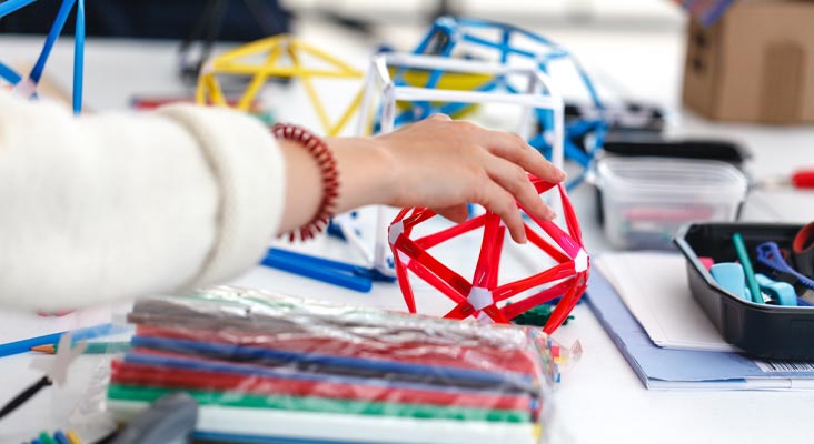 day-center-teaser@2x close up of hands and geometry models